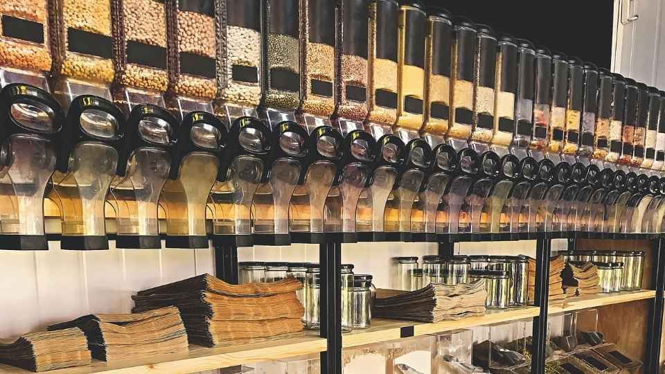 A refill station featuring lots of jars full of different products