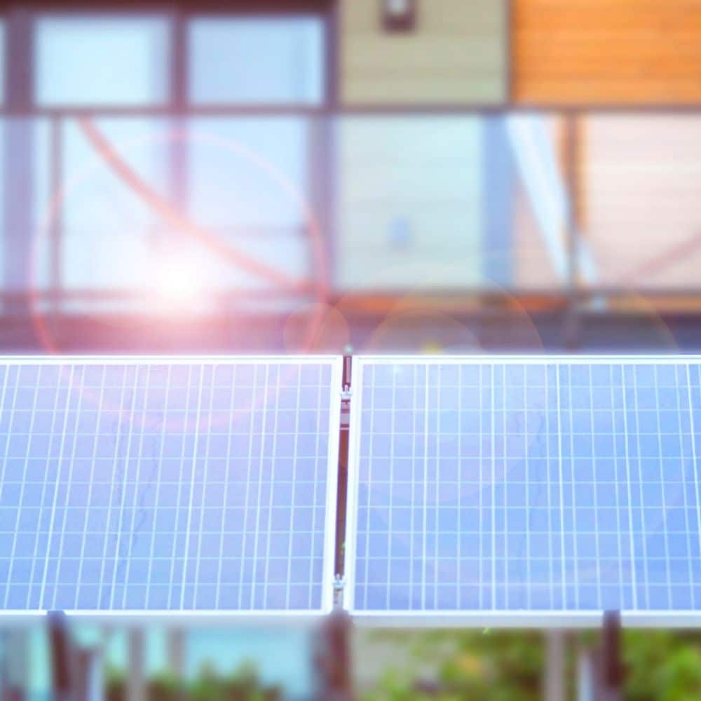 Future Leap Consultancy, Image of solar panels against a building backdrop
