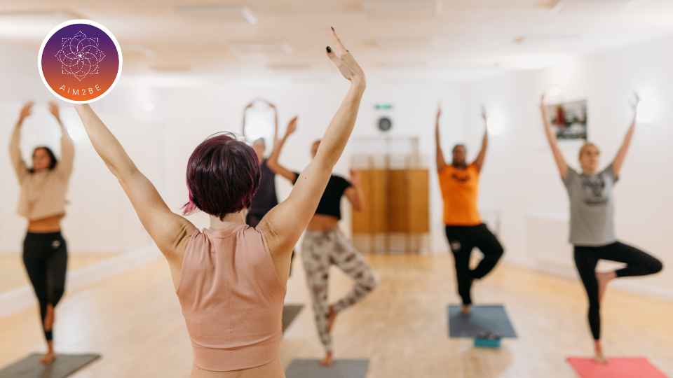 A group of people doing yoga.