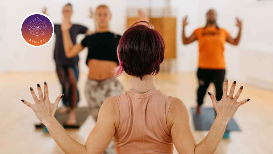 Group of people doing yoga.