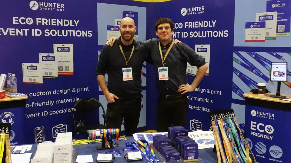 2 men from Hunter Operations at an exhibition promoting their eco friendly event ID solutions